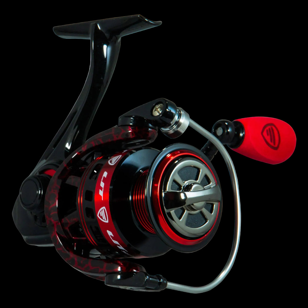A high-performance spinning fishing reel with a black and red metallic body, a red handle grip, and a silver metal bail, shown on a solid white background.