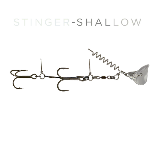 A fishing lure labeled 'STINGER-SHALLOW' on a plain white background. The lure has a metallic silver body with a coiled spring, a clear plastic diving bullet, and multiple treble hooks.