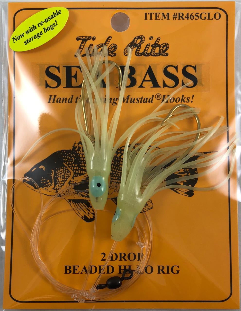 A packaged fishing lure set labeled Tide Rite Sea Bass, showing two translucent pale green soft bait hooks with bead lines on an orange backing card.