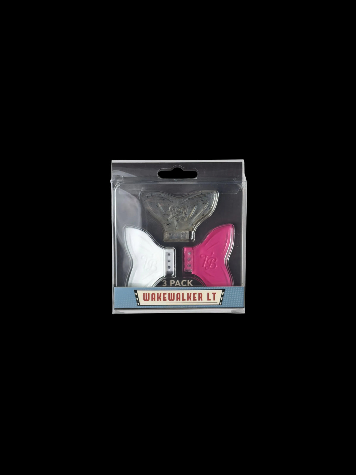 A packaged set of three WakeWalker LT novelty items in a clear blister pack with a black backing card. The set includes a silver metallic gothic-style letter 'L', a white letter 'W' shaped piece, and a pink letter 'A' shaped piece, with a blue and white label at the bottom reading 'WAKEWALKER LT 1 PACK'.