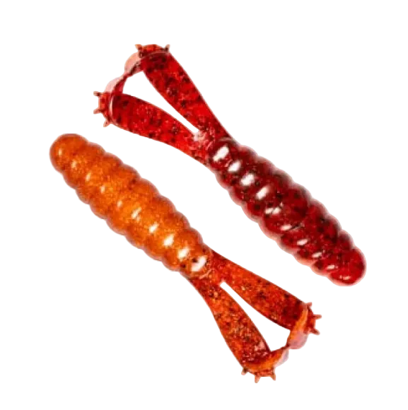 Two soft plastic fishing lures on a plain white background, one in translucent orange-brown and the other in translucent red with dark glitter.
