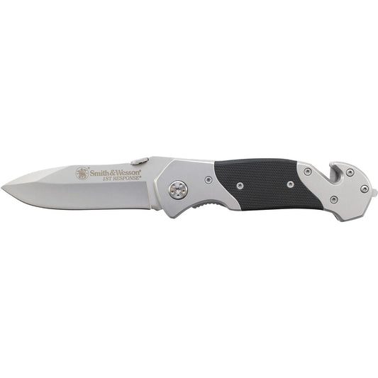 Open silver and black Smith & Wesson folding knife with textured grip and rescue tool.
