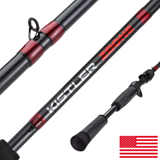 Close-up of a Kistler ZONE fishing rod showing the black and red carbon fiber shaft, line guide, textured handle, and a small American flag graphic in the bottom right corner.