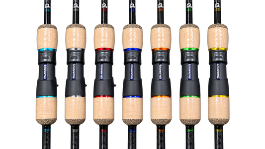 Six fishing rods arranged side by side on a white background, each showing a different colored anodized aluminum guide sleeve with the brand name Palmarius visible.