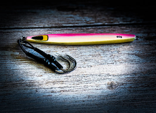 Fishing lure with hook on a wooden surface