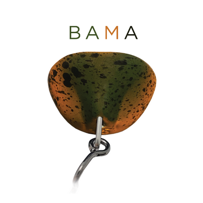 Speckled orange and green fishing lure with 'BAMA' branding on a white background