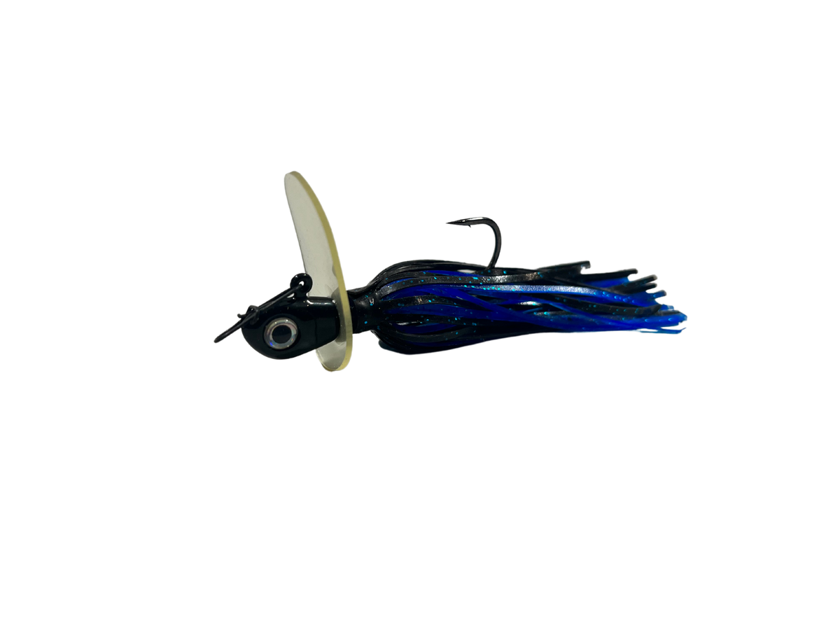 Fishing lure with a white body and blue and black skirt on a white background