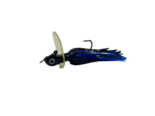 Fishing lure with a white body and blue and black skirt on a white background