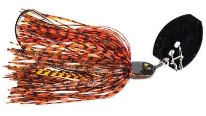 A fishing spinnerbait lure with a black blade, chrome metal body, and a skirt made of orange and black striped silicone strands with a yellow and black patterned section.