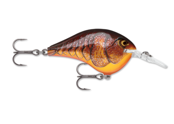Dark brown and orange crawdad fishing lure with two treble hooks.