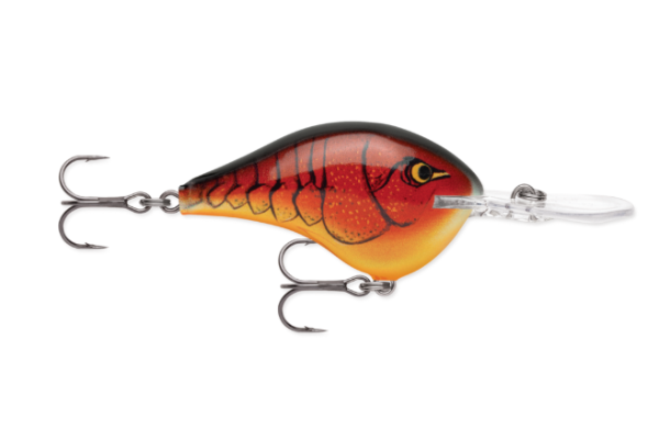 Red and orange crawfish fishing lure with black scales and two treble hooks.