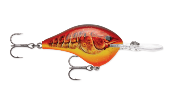 Glittery red and orange crawfish fishing lure with yellow belly and two hooks.