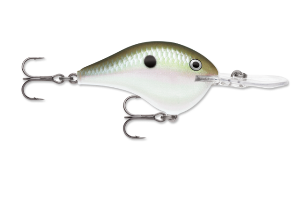 Green and white fishing lure with a black spot and two treble hooks.