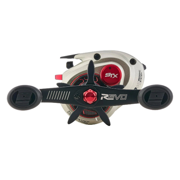 Silver and black Abu Revo STX low profile fishing reel with red accents.