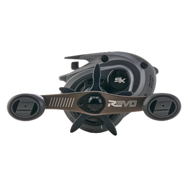 Dark gray low profile fishing reel with bronze handle and Revo SX logos.