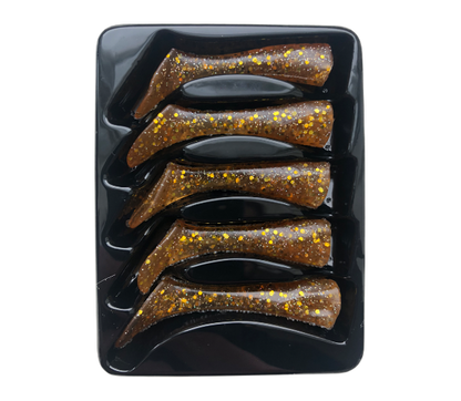 Set of five glittery brown fishing lures in a black holder on a white background