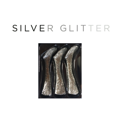 Silver glitter high-heeled shoes in a black box on a white background with 'SILVER GLITTER' text.