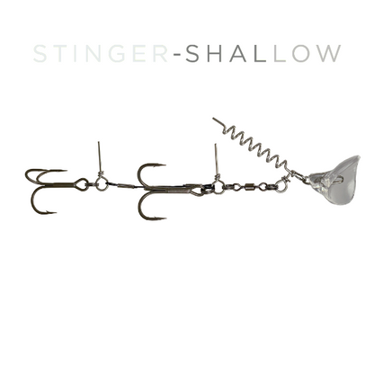 A fishing lure labeled 'STINGER-SHALLOW' on a plain white background. The lure has a metallic silver body with a coiled spring, a clear plastic diving bullet, and multiple treble hooks.
