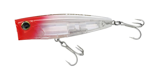 A hard bait fishing lure with a red-to-clear gradient body, a black eye, and two silver treble hooks attached, shown on a plain white background.