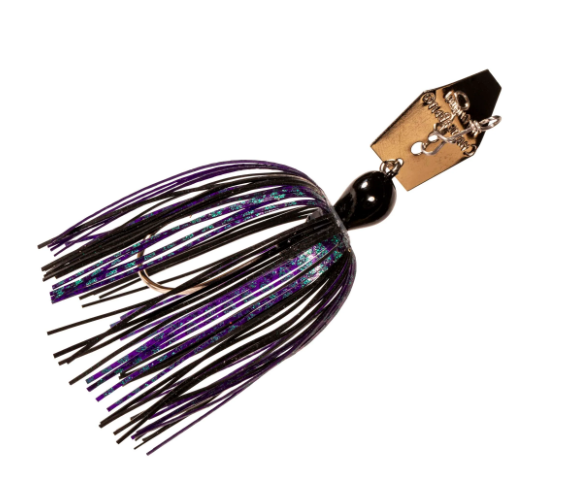 A fishing jig lure with a gold-colored metal head, a black bead, and a skirt made of black and purple silicone strands with a subtle blue-green iridescent shimmer.