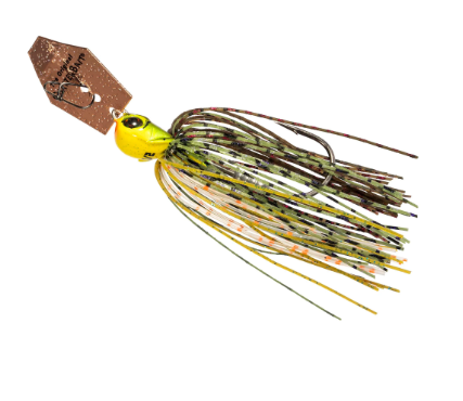 A fishing jig lure with a bright yellow head, a brown glitter top, and a skirt made of green, brown, and yellow striped strands, isolated on a white background.