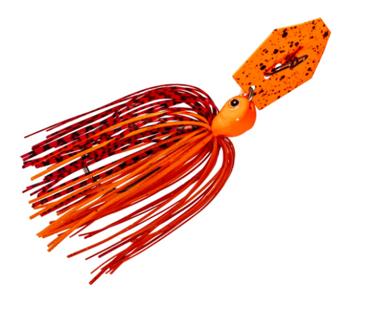 An orange and red soft plastic fishing jig with a speckled orange top blade, set against a solid white background.