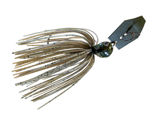 A metal fishing jig lure with a dark metallic head, a silver split ring, and a skirt made of tan and silver glitter strands, isolated on a white background.