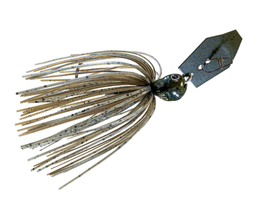 A fishing jig lure with a metallic silver blade, a dark green head, and a skirt made of tan and white speckled strands, isolated on a white background.