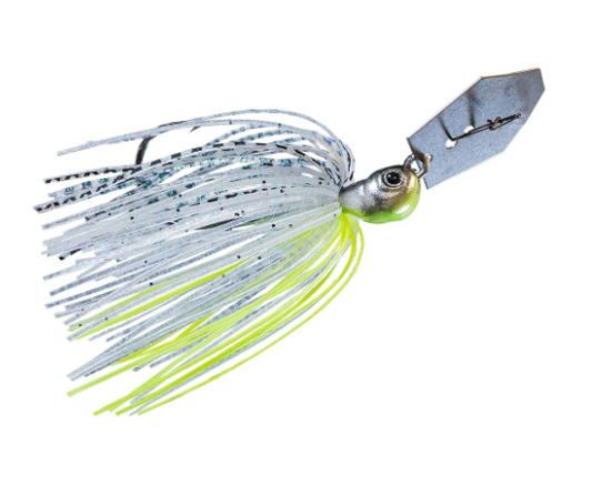 A fishing jig lure with a silver metal blade, a realistic eye, and a skirt made of silver and neon yellow-green strands, isolated on a white background.