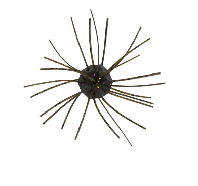 Dark spiky fishing lure with radiating brown-green tentacles and colorful flecks.