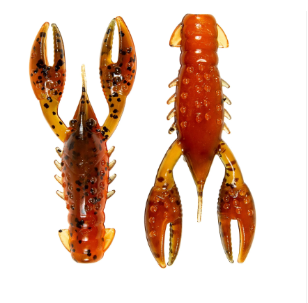 Two translucent amber-brown crayfish-shaped soft plastic fishing lures shown side by side on a plain white background, one facing forward and one facing backward.