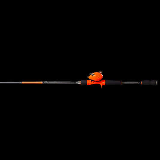 A fishing rod with a bright orange and black handle, featuring a small cartoon bear-shaped weight on top, shown against a solid white background.