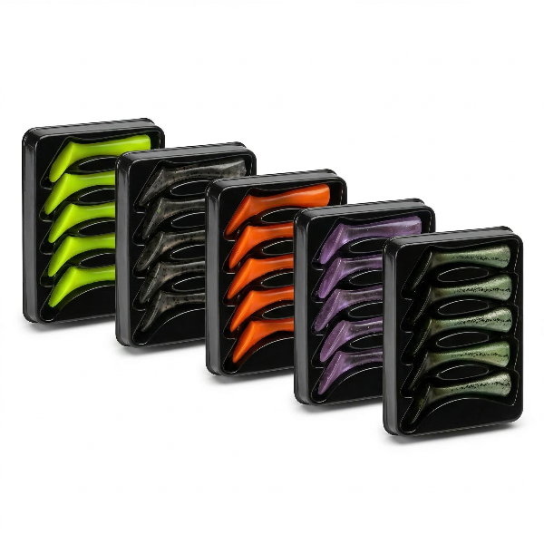Four rectangular black trays containing multiple curved silicone or rubber Fishing Lures in assorted colors, arranged diagonally on a white background.