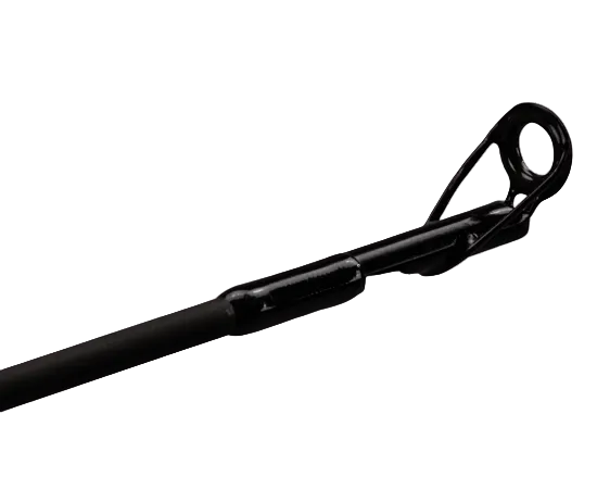 Close-up of a black fishing rod tip with a looped line guide, shown against a solid green background.