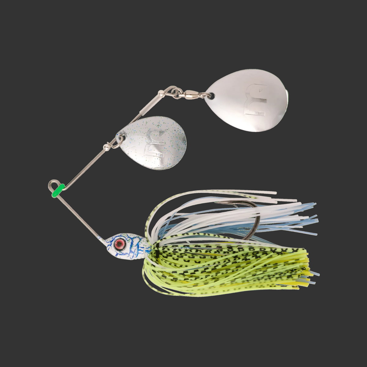 Fishing lure with metallic body and colorful skirt on a transparent background