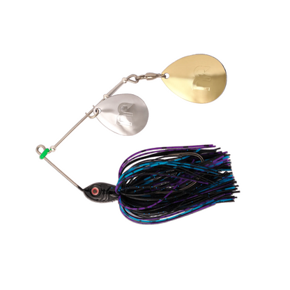 A spinnerbait fishing lure with two blades, one gold and one silver, connected by a metal rod to a black skirt with purple, blue, and black strands.