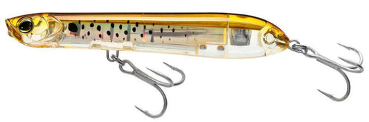 Fishing lure with a shiny gold and clear body on a white background